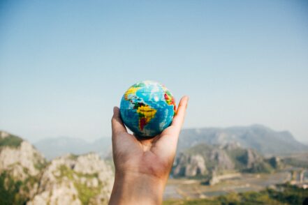 Picture of a hand holding a small globe