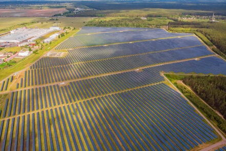 Solar power plant in the field. Aerial view of Solar panels. Solar farm. The source of ecological renewable energy.